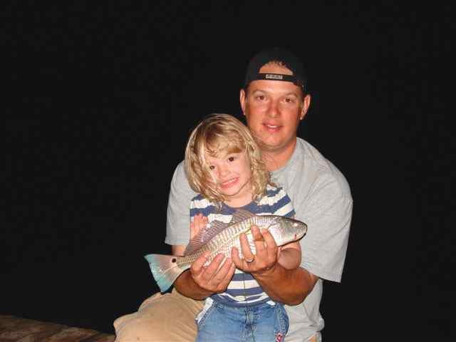 Paige Sitterle and dad, Matt first redfish!