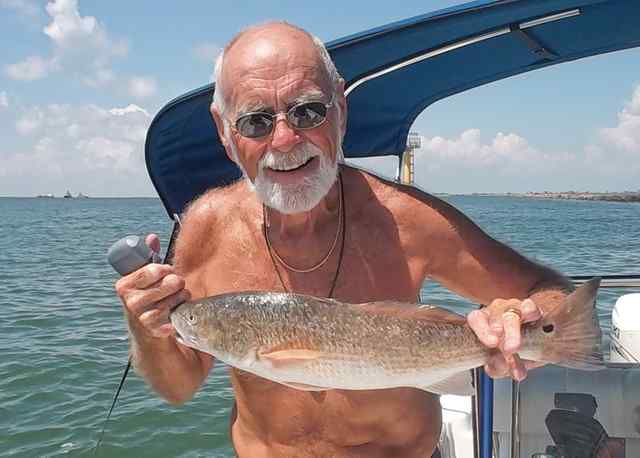 George Brady Galveston South Jetty27&quot; first redfish! Caught on cut mullet