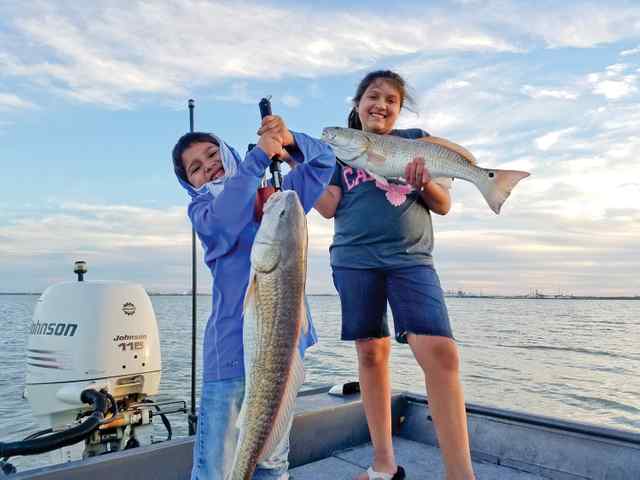 Darren & Emma Doria Nueces back bay - 31.5" & 27.5" redfish, caught on live mullet