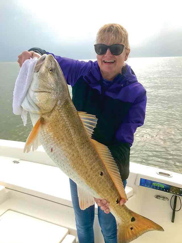 Debbie Chambers Trinity Bay - 33" personal best redfish! CPR, caught under birds