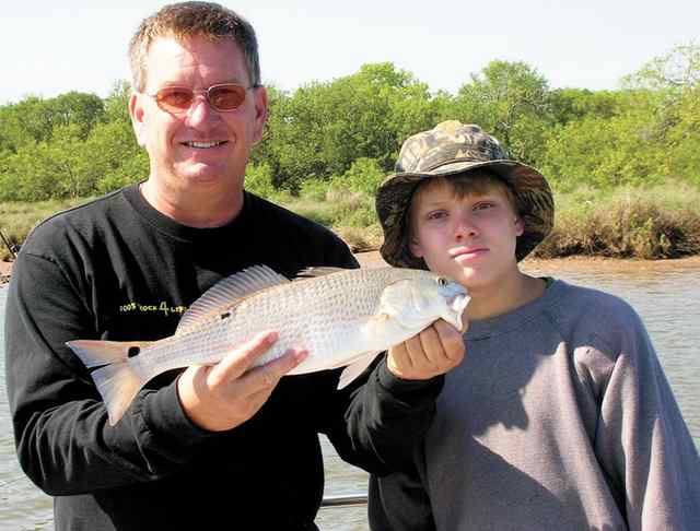 Joel McCommon and son, Conner Conner's first red