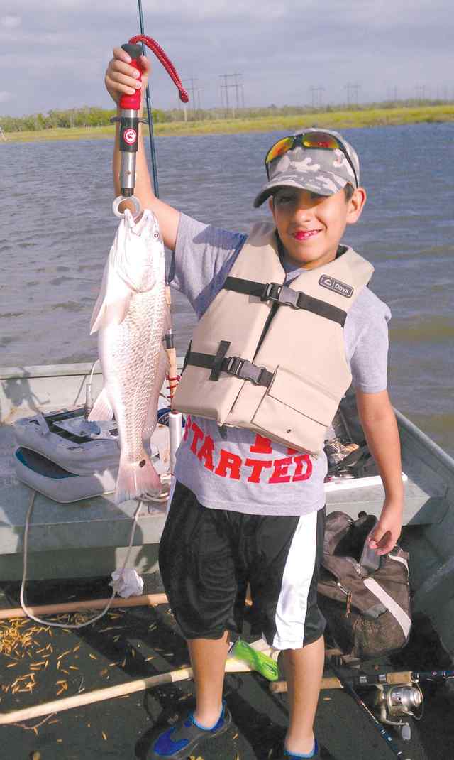 Ricky Chavez Dickinson Bayou23&quot; first redfish!