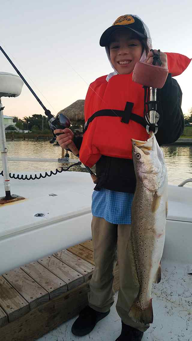 Brandyn Kyrisch Ingleside Cove - 24" first keeper trout! caught on a piggy perch, fishing with his grandpa Bill