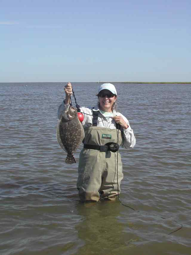 Karen Clock East Bay in Galvestonfirst flounder in artificial!