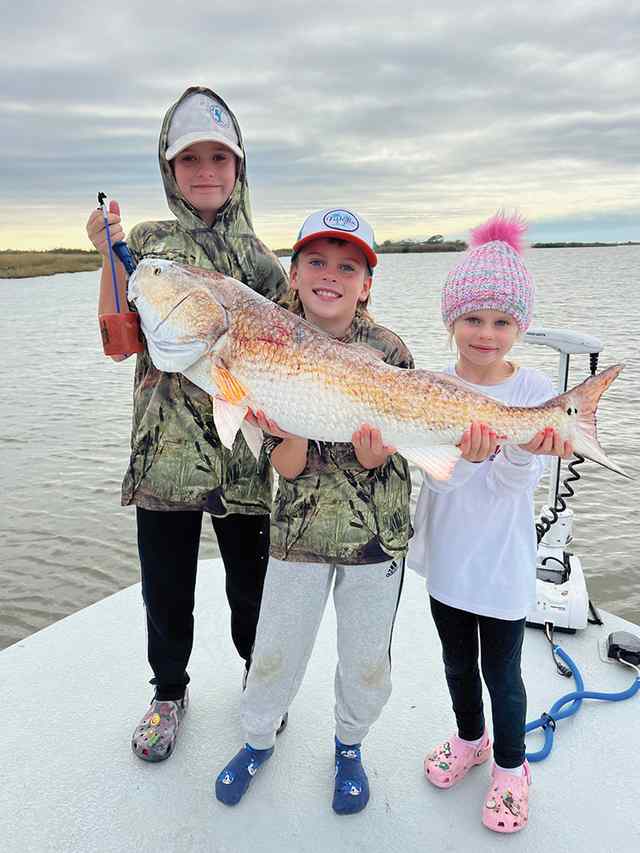 Miles Willcox (middle), with brother, Mason, and sister, Mila Dularge, LA - 41" 36 lb first redfish!