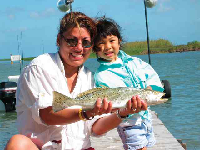Anna Cooper and daughter, Keira Seadriftshowing off mom's 22&quot; trout