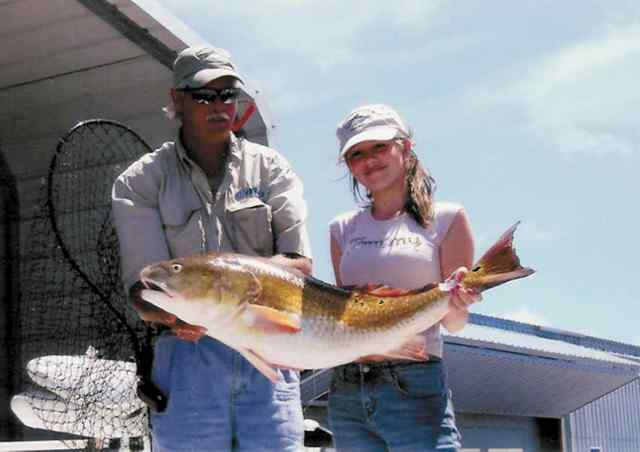 Hailey Taylor and step-father Kenny Thompson Hailey's first big red!