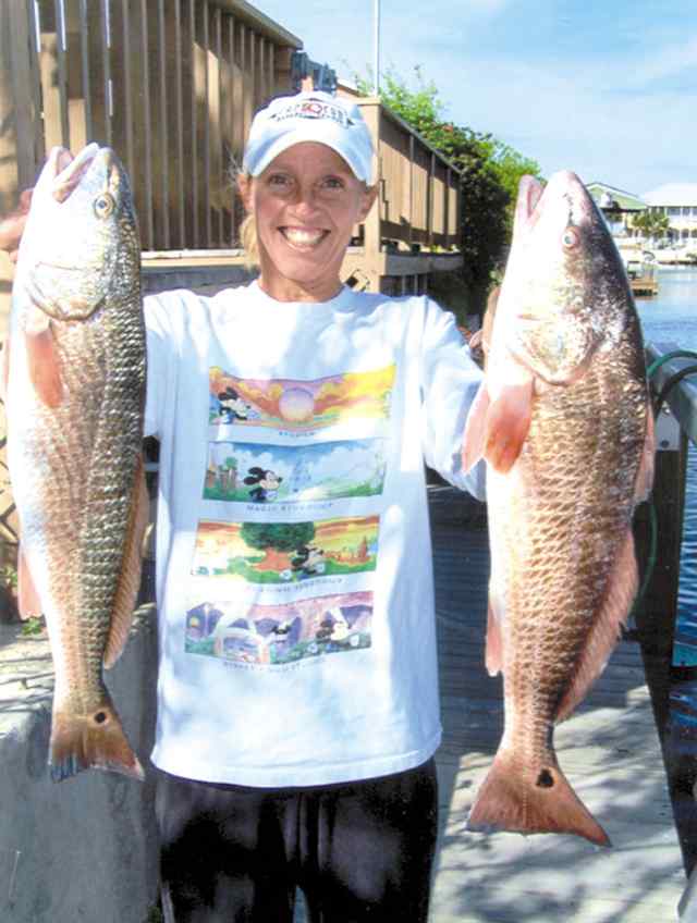 Kelli Smith Out fished the rest of her family with this nice pair of reds