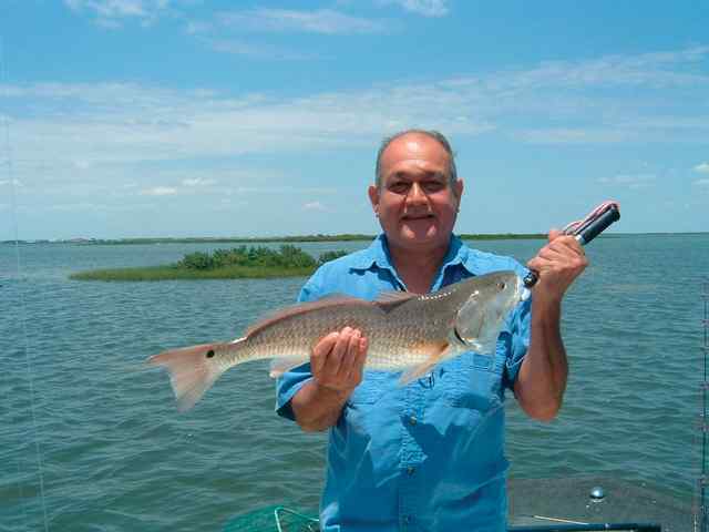 Ralph Betancourt Dagger Island27&quot; first redfish!