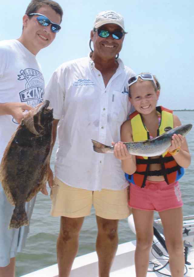 Katelyn Ellis and Clifton Gillock showing off their catches