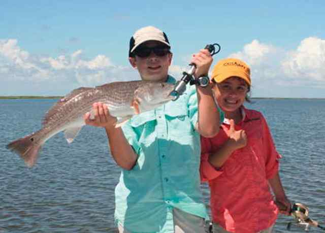 Jacob and Caitlin Rodgers Having fun catching fish like this nice red while out in Port O'Connor