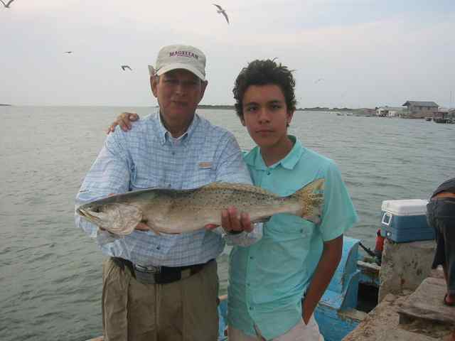 Ricardo Espinosa and grandson, Carlos Port Mansfield28" trout