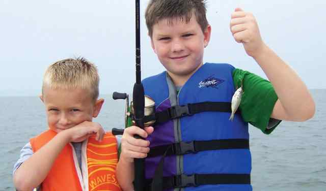 Slater Curl proudly showing off his little catch of the day