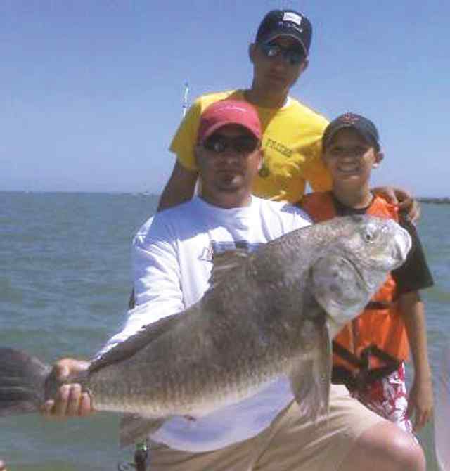 Juan Galvan with dad & brother Galvestonfirst drum!