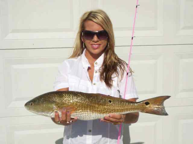 Lindsey Smith Looking dynamite with her redfish and pink rod!