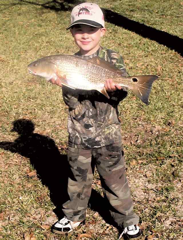 Hunter Cunningham Freeport25&quot; red, caught while fishing with his grandfather
