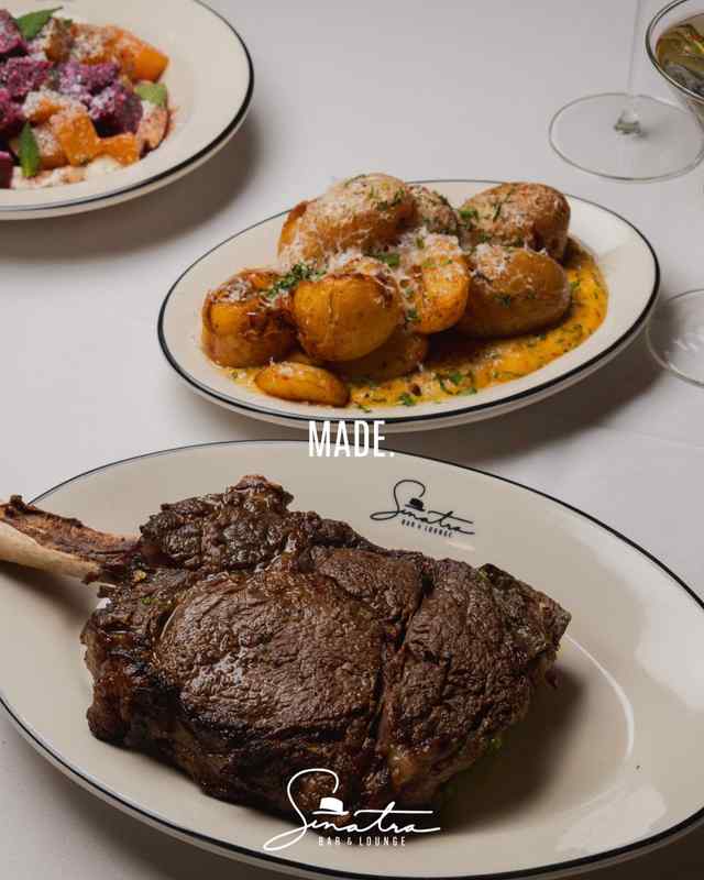 Tomahawk steak cooked sinatra bar and lounge nashville.jpg Tomahawk steak cooked sinatra bar and lounge nashville.jpg